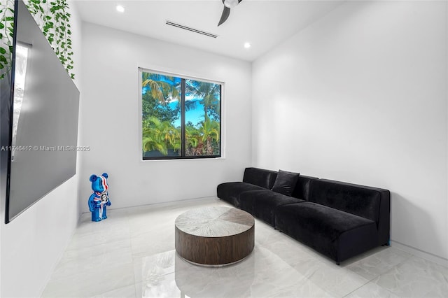 living area featuring ceiling fan