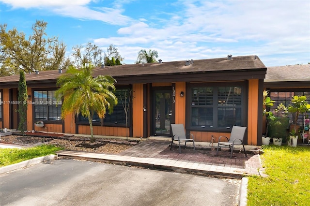 entrance to property with a patio area