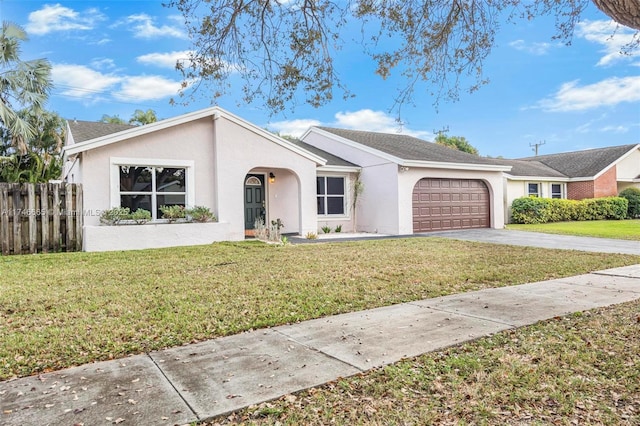 ranch-style house with a garage and a front yard