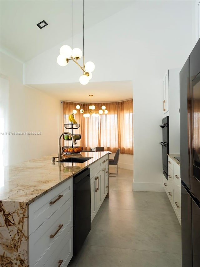 kitchen featuring light stone counters, a notable chandelier, black appliances, white cabinetry, and a sink