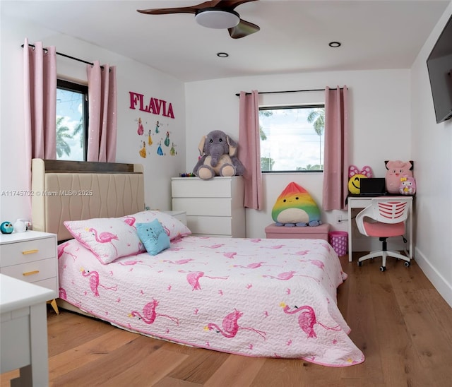 bedroom with recessed lighting, wood finished floors, a ceiling fan, and baseboards