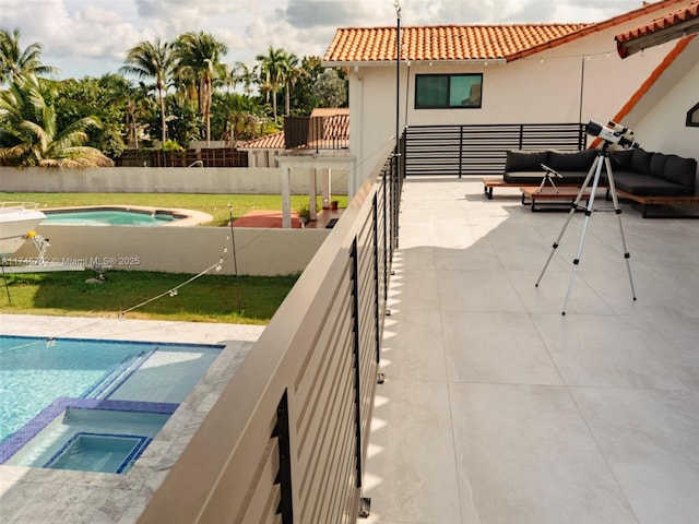 view of swimming pool with a pool with connected hot tub and an outdoor hangout area