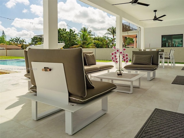 view of patio featuring ceiling fan, outdoor dining area, and a fenced in pool