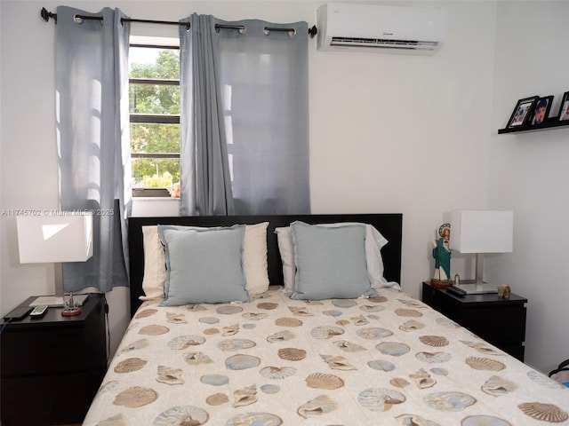 bedroom featuring an AC wall unit