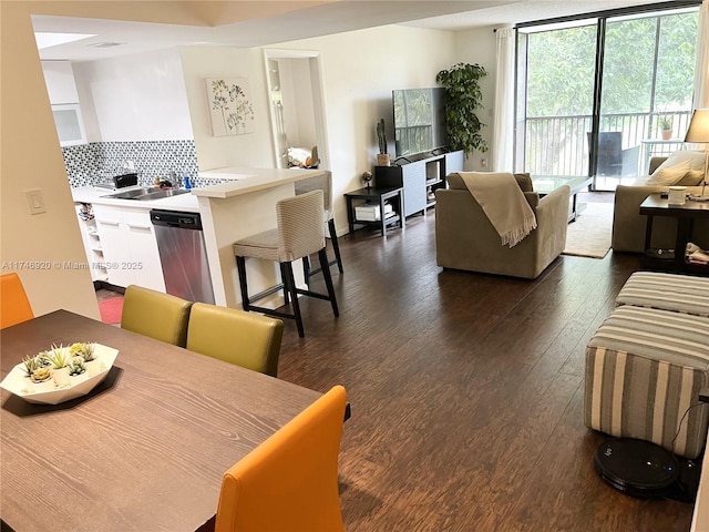 dining room featuring dark hardwood / wood-style floors and sink