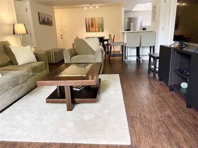 living room featuring dark hardwood / wood-style flooring