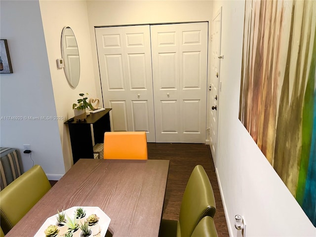 dining area with dark hardwood / wood-style floors