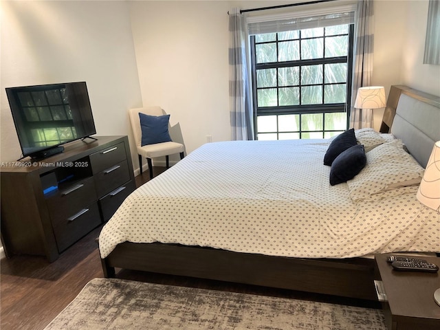 bedroom featuring dark hardwood / wood-style floors