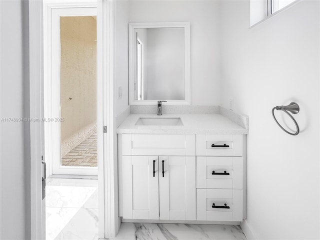 312 SE Via Sangro Prt, St Lucie, FL 34952 - bathroom featuring marble finish flooring and vanity