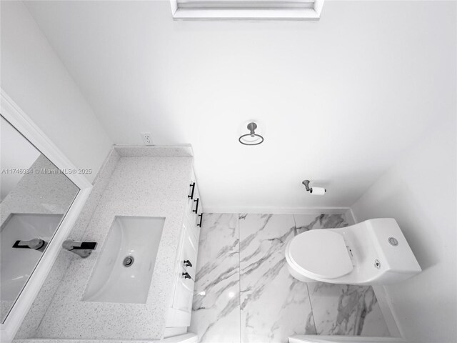 312 SE Via Sangro Prt, St Lucie, FL 34952 - bathroom with marble finish floors and vanity