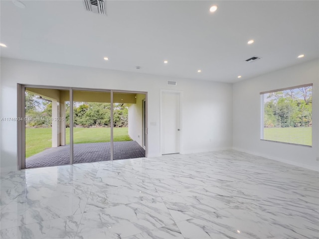 312 SE Via Sangro Prt, St Lucie, FL 34952 - empty room with recessed lighting and marble finish floors