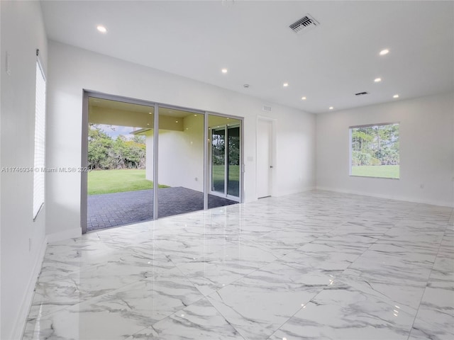 312 SE Via Sangro Prt, St Lucie, FL 34952 - spare room featuring recessed lighting and marble finish flooring