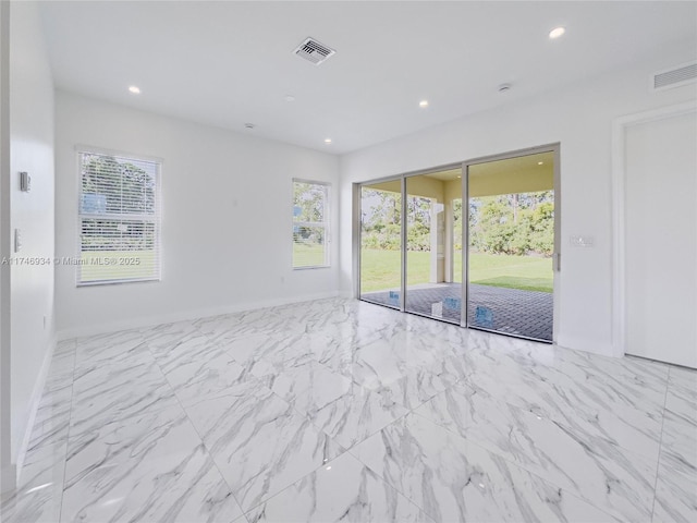 312 SE Via Sangro Prt, St Lucie, FL 34952 - spare room with recessed lighting and marble look tiles