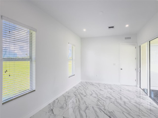 312 SE Via Sangro Prt, St Lucie, FL 34952 - empty room with marble finish floors and recessed lighting