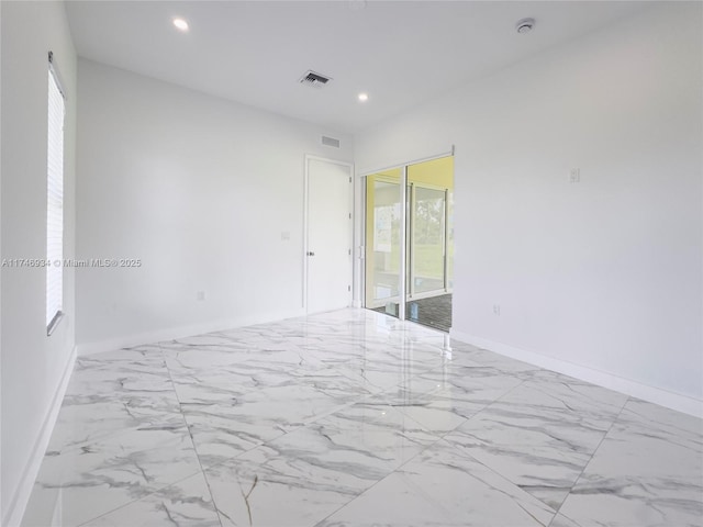 312 SE Via Sangro Prt, St Lucie, FL 34952 - empty room with marble finish flooring, healthy amount of natural light, recessed lighting, and a smoke detector