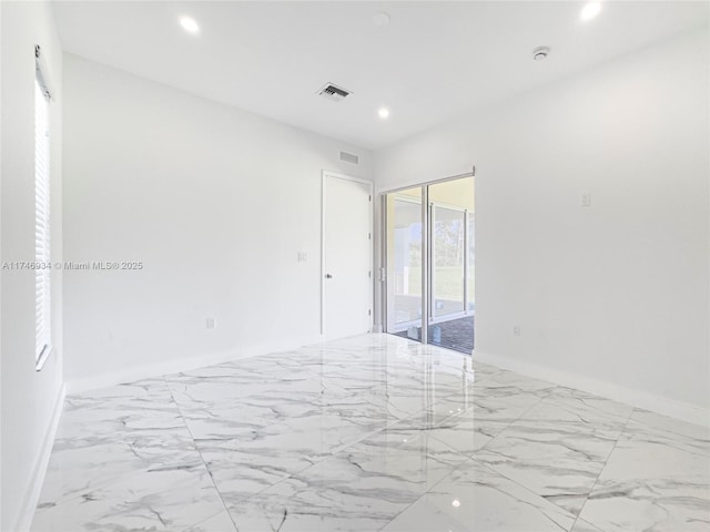 312 SE Via Sangro Prt, St Lucie, FL 34952 - spare room with marble look tile flooring and recessed lighting