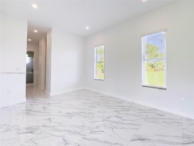 312 SE Via Sangro Prt, St Lucie, FL 34952 - spare room with recessed lighting and marble tiled flooring