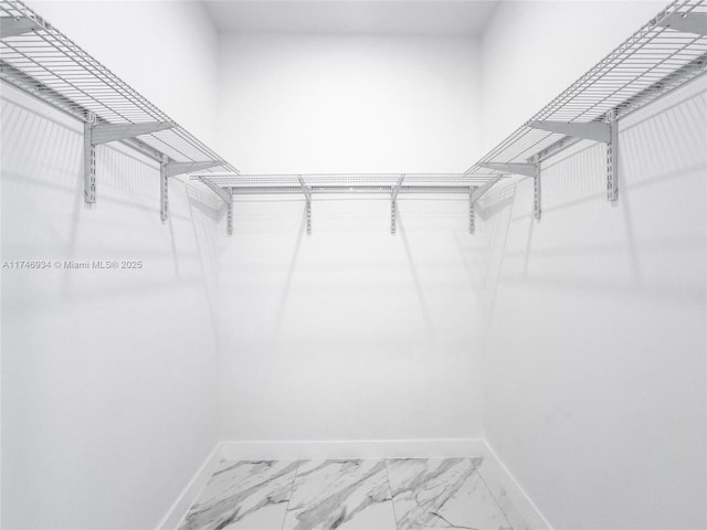 312 SE Via Sangro Prt, St Lucie, FL 34952 - walk in closet with marble look tiles