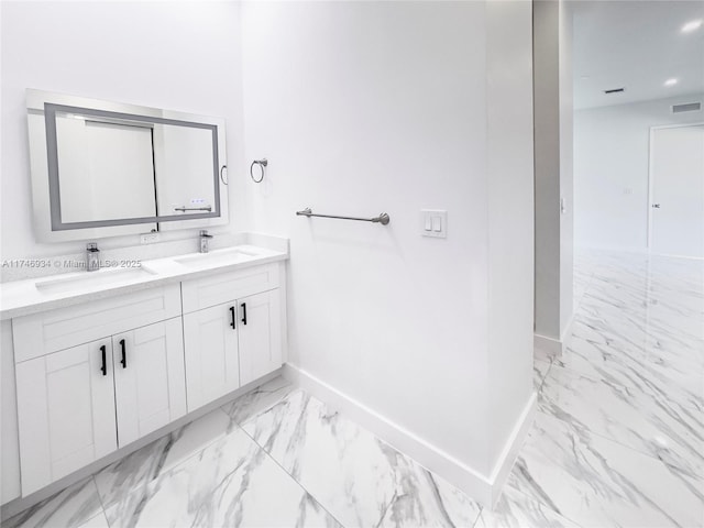 312 SE Via Sangro Prt, St Lucie, FL 34952 - bathroom featuring marble look tile flooring and double vanity