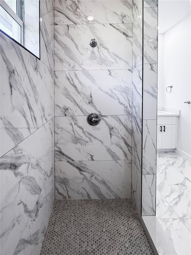 312 SE Via Sangro Prt, St Lucie, FL 34952 - bathroom featuring a marble finish shower and vanity