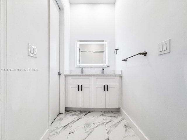 312 SE Via Sangro Prt, St Lucie, FL 34952 - bathroom featuring double vanity and marble look tiles