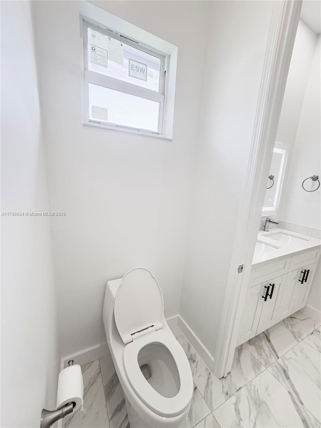 312 SE Via Sangro Prt, St Lucie, FL 34952 - bathroom with marble look tile flooring and vanity