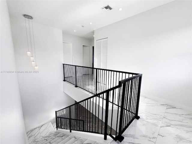312 SE Via Sangro Prt, St Lucie, FL 34952 - stairs featuring marble finish flooring and recessed lighting