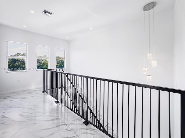 312 SE Via Sangro Prt, St Lucie, FL 34952 - hall with marble tiled flooring, plenty of natural light, recessed lighting, and an upstairs landing