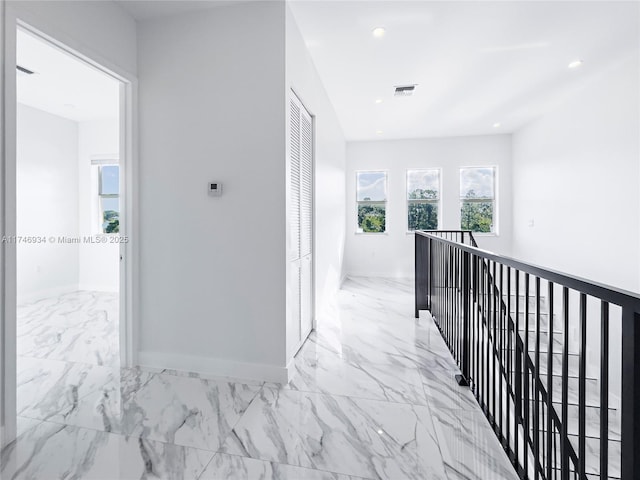 312 SE Via Sangro Prt, St Lucie, FL 34952 - hallway featuring an upstairs landing, light marble finish floors, and recessed lighting