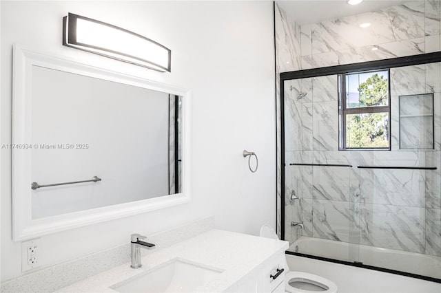 312 SE Via Sangro Prt, St Lucie, FL 34952 - bathroom with vanity, shower / bath combination with glass door, and recessed lighting