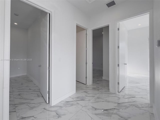 312 SE Via Sangro Prt, St Lucie, FL 34952 - hall featuring light marble finish floors and recessed lighting