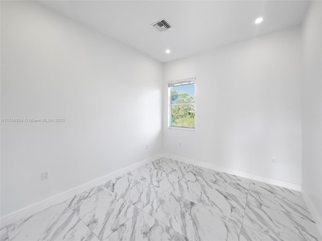 312 SE Via Sangro Prt, St Lucie, FL 34952 - unfurnished room with recessed lighting and light marble finish flooring