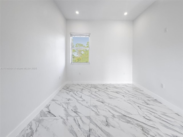 312 SE Via Sangro Prt, St Lucie, FL 34952 - spare room with recessed lighting and marble look tiles