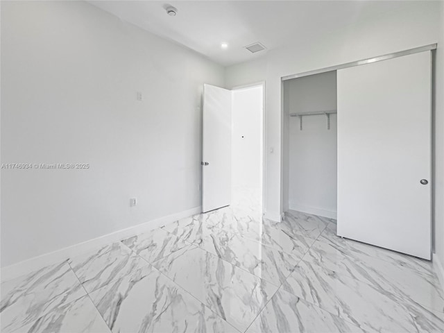 312 SE Via Sangro Prt, St Lucie, FL 34952 - unfurnished bedroom with a closet and light marble finish flooring