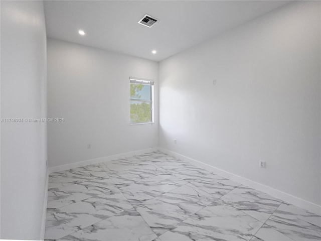 312 SE Via Sangro Prt, St Lucie, FL 34952 - spare room featuring marble look tile flooring and recessed lighting