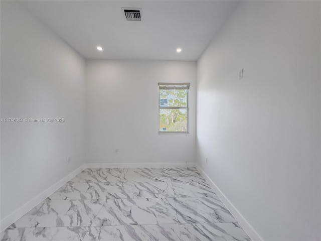 312 SE Via Sangro Prt, St Lucie, FL 34952 - spare room with marble finish flooring and recessed lighting