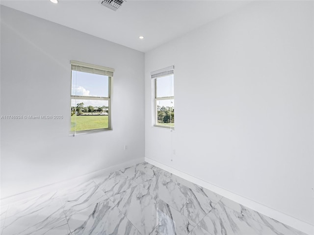 312 SE Via Sangro Prt, St Lucie, FL 34952 - unfurnished room featuring light marble finish flooring and recessed lighting