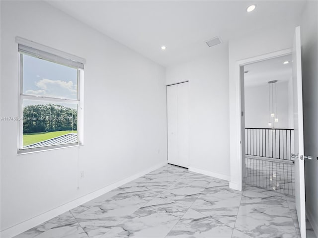 312 SE Via Sangro Prt, St Lucie, FL 34952 - unfurnished room with recessed lighting and light marble finish flooring