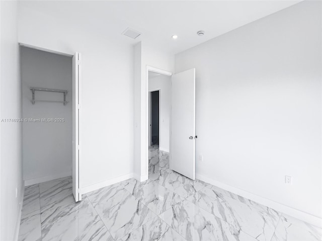 312 SE Via Sangro Prt, St Lucie, FL 34952 - unfurnished bedroom with marble finish floors, recessed lighting, and a closet