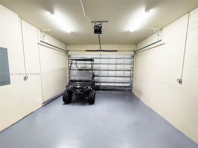 312 SE Via Sangro Prt, St Lucie, FL 34952 - garage featuring a garage door opener and electric panel