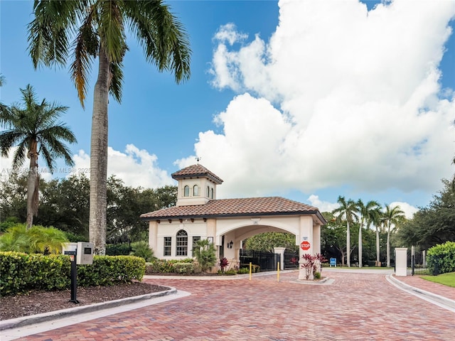 312 SE Via Sangro Prt, St Lucie, FL 34952 - view of front of home with stucco siding and a tile roof