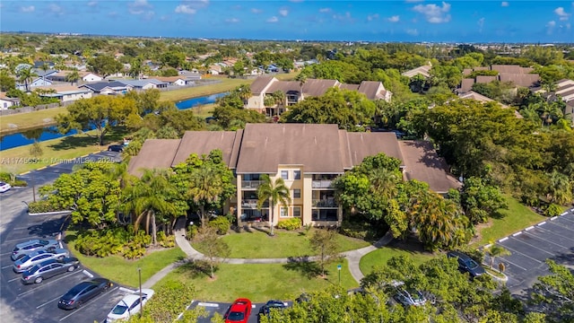 bird's eye view featuring a water view and a residential view