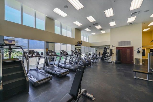 workout area with a high ceiling