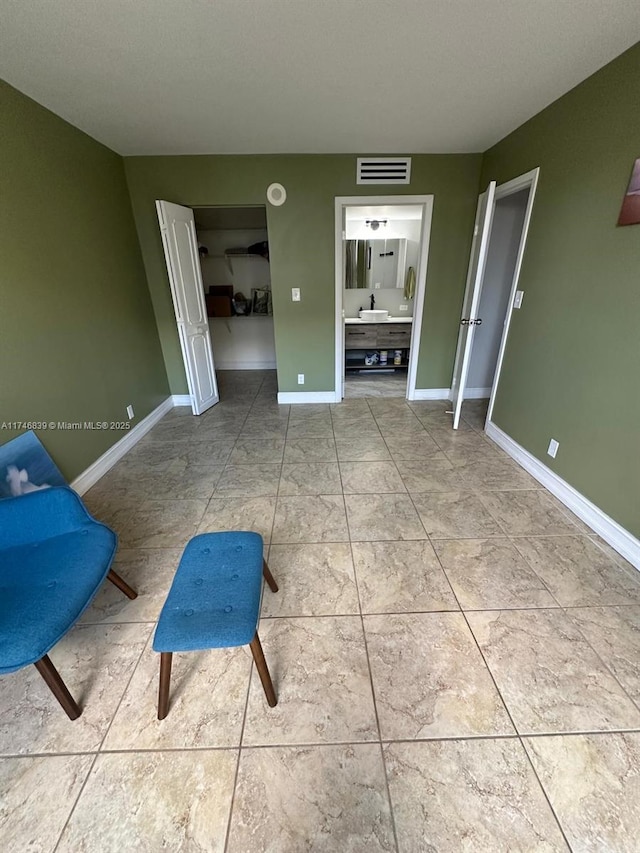 17011 N Bay Rd Unit 507, Sunny Isles Beach, FL 33160 - unfurnished bedroom featuring baseboards and ensuite bath