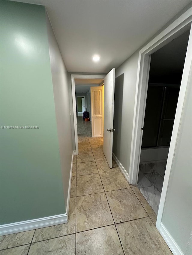 17011 N Bay Rd Unit 507, Sunny Isles Beach, FL 33160 - hallway featuring baseboards and light marble finish flooring