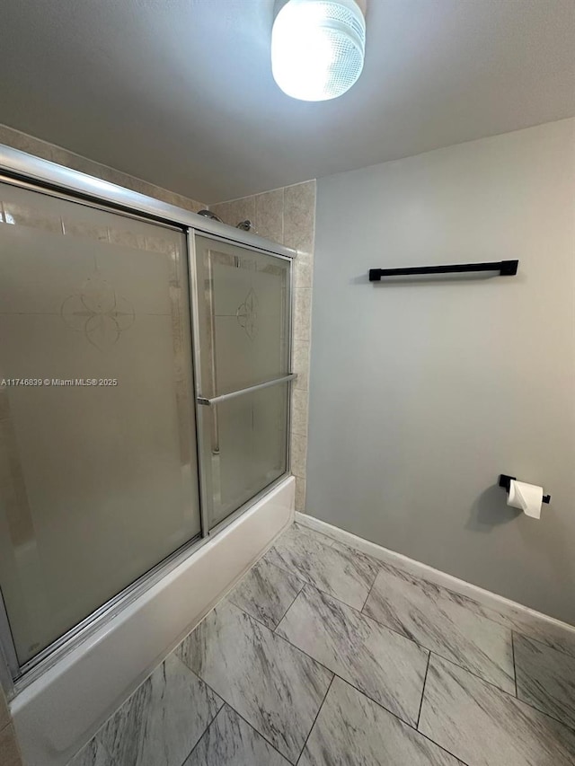 17011 N Bay Rd Unit 507, Sunny Isles Beach, FL 33160 - full bathroom with bath / shower combo with glass door and marble look tile flooring