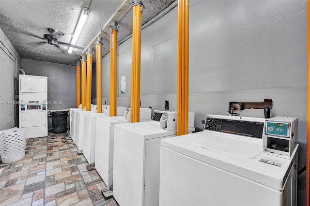 laundry area featuring washing machine and dryer and stacked washer and dryer