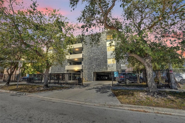 view of outdoor building at dusk