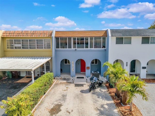 view of front of house featuring cooling unit