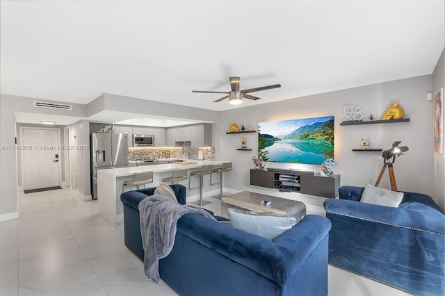 living room featuring ceiling fan